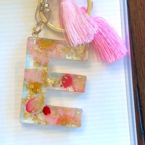 COPY - NIB clip on keychain pressed flower with tassel. Initial E.